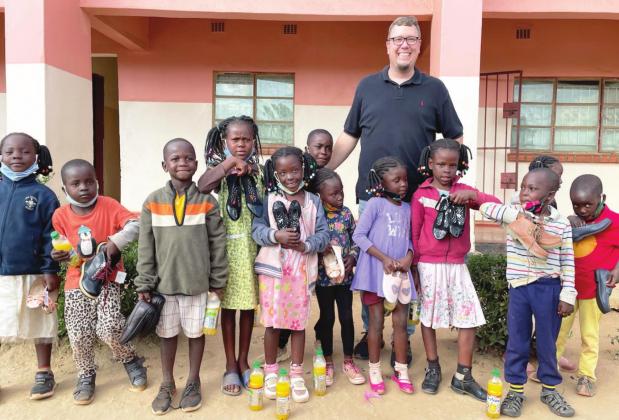 Pauls Valley Compassion Church Pastor Andy Davidson visited children in care at the House of Mordecai Children’s Home in Zambia, Africa, earlier this summer. The children went on a field trip to choose and purchase new shoes through donations from local partners. Courtesy Photo