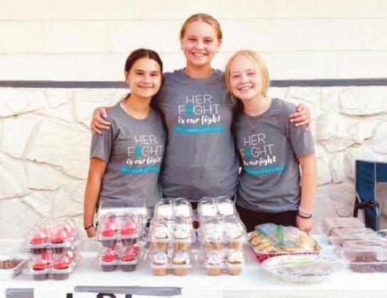 Local students (L-R) Brinley Hines, Lola Ferris and Layni Ferris raised $4,200 over the weekend at a bake sale for Elmore City's Danna Lauderdale. Lauderdale is battling Atypical Neuroendocrine (Atypical Carcinoid) lung cancer. She is a mother to five boys.