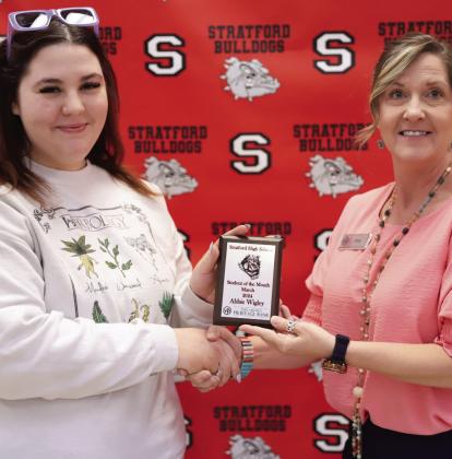 Stratford senior Abbie Wigley receives the March student of the month award from Dina Henley of Oklahoma Heritage Bank.
